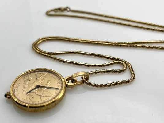 Münzuhr Corum an Kette, Gelbgold 750, punziert und getestet.