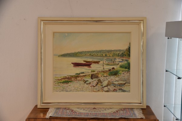 Einhart, Karl (1884-1967) Bodensee-Bucht, Blick auf eine Bucht am Bodensee, mit Booten im Wasser und Steinen am Ufer, Öl auf Leinwand.